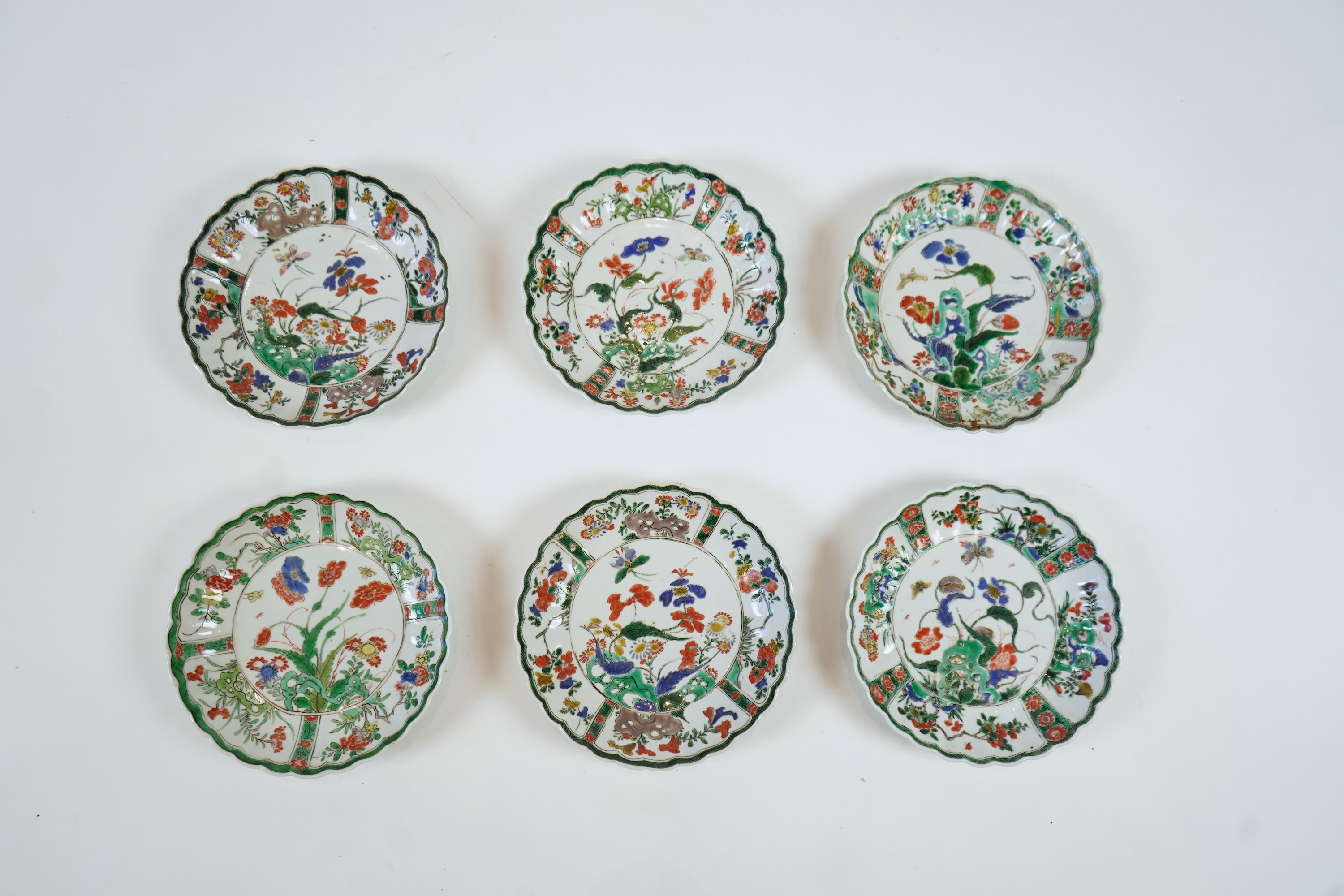 A set of six Chinese famille verte petal lobed saucer dishes, Kangxi period